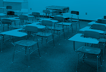 grade school desk in clean facility classroom