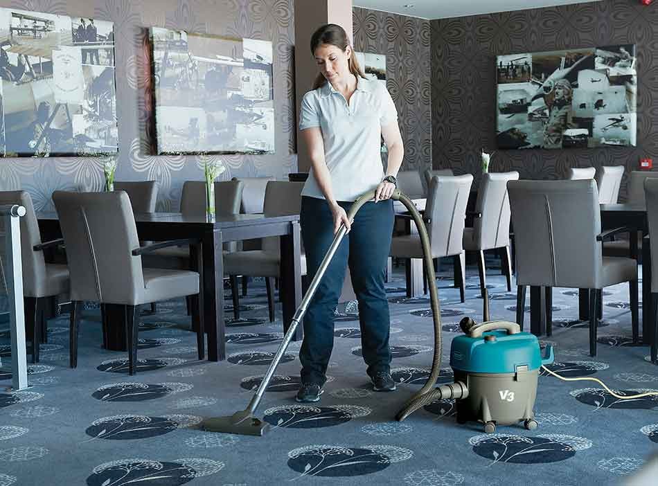 Tennant vacuum cleaning floor of restaurant