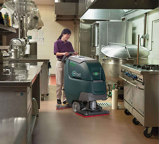 Nobles Speed Scrub 300 cleaning a kitchen floor.