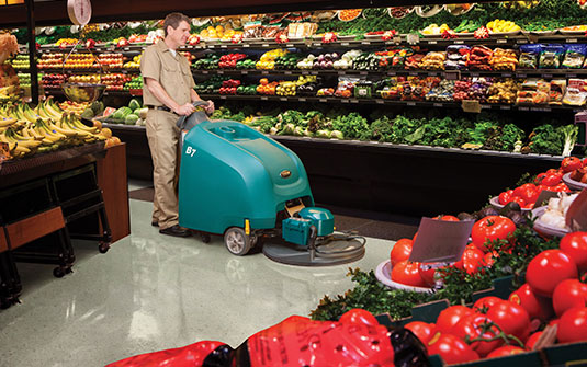 Tennant burnisher cleaning a grocery store