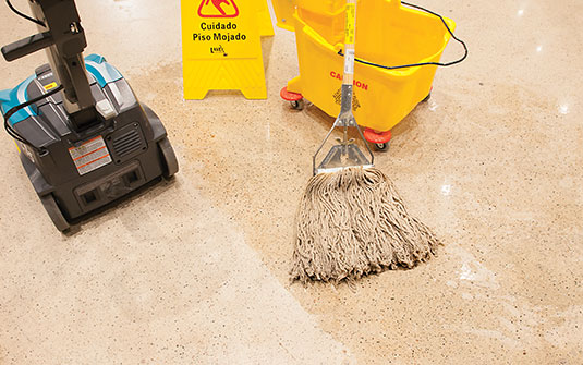 Tennant CS5 small walk behind floor scrubber versus a mop