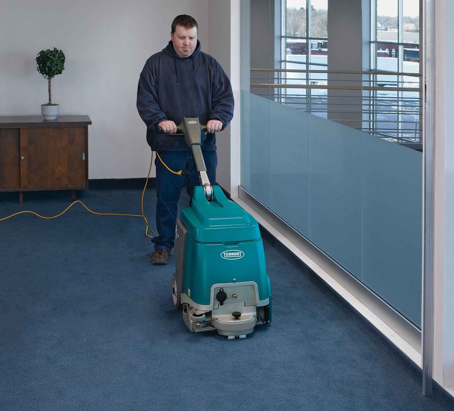 R3 Walk-Behind Extractor cleaning a carpeted floor