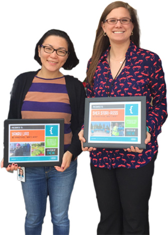 Tennant employees, Yanru Liao and Shea Stori-Ross, standing next to each other holding awards.