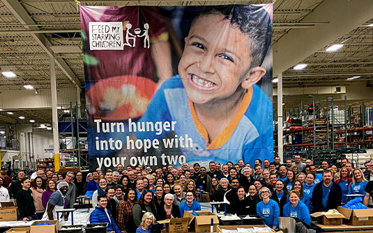 Tennant volunteers at Feed My Starving Children