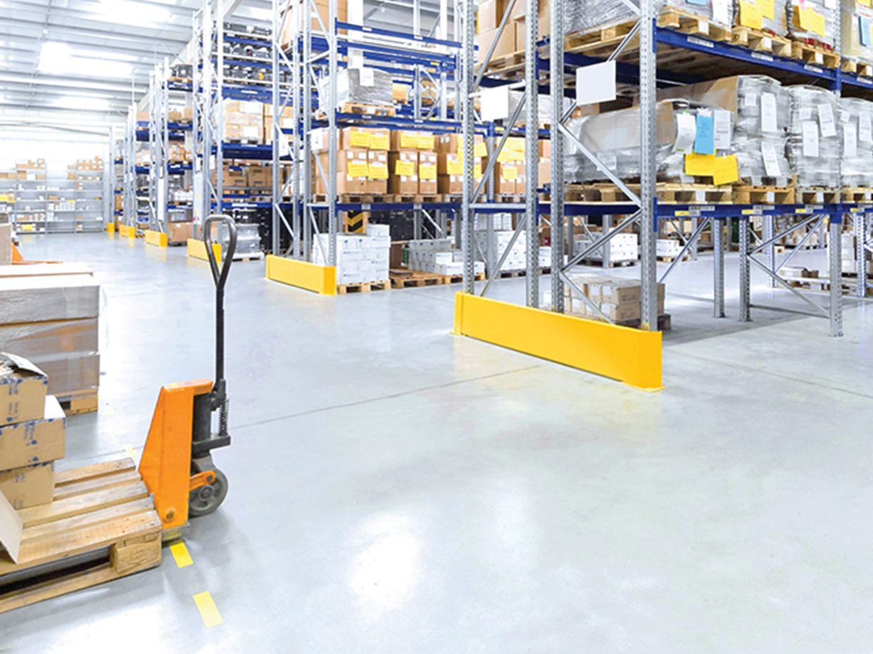 Shiny concrete floor in warehouse environment