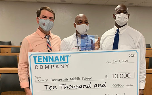 Alonzo Henley of Brownsville Middle School in Miami, Florida was presented with a $10,000 check for his school at a surprise celebration on Tuesday, June 1.
