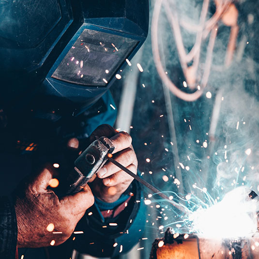 welder in manufacturing shop