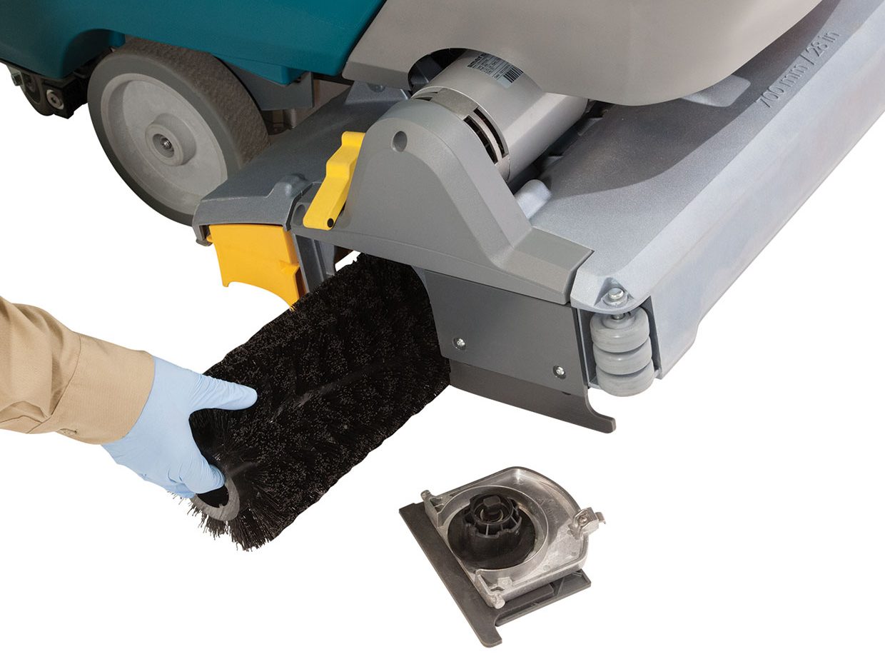 Technician changing a cylindrical brush